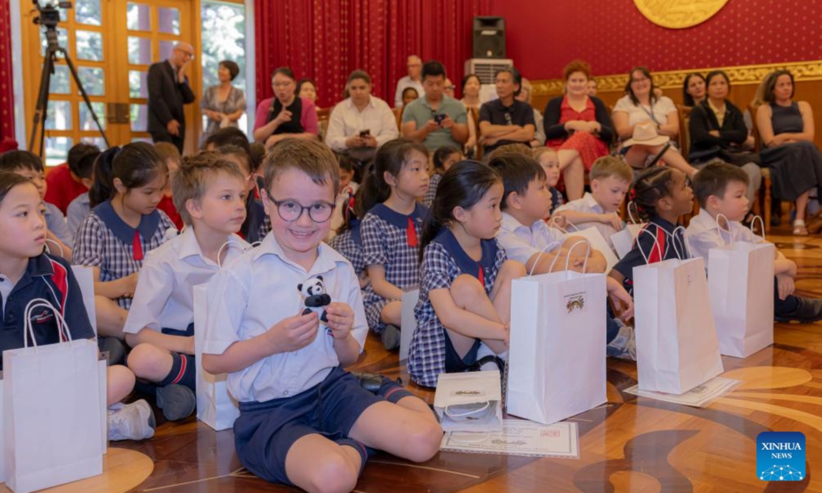 A student shows his panda doll award during the Panda Competition at the Chinese Embassy in Australia, in Canberra, Australia on Nov. 6, 2024. Australian children in Canberra were awarded on Wednesday for their paintings, sculptures, poems, creative collage and constructions surrounding the subject of the Chinese and the Australian gold rushes.  (Photo: Xinhua)