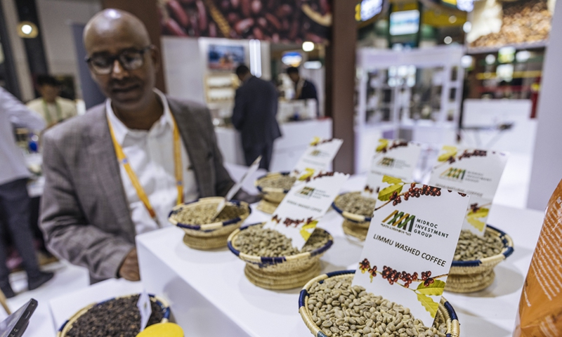 An exhibitor presents coffee products at the booth of Ethiopia at the 7th CIIE in Shanghai on November 7, 2024. Photo: Li Hao/GT