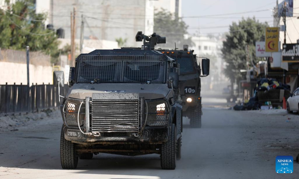 Israeli military vehicles are seen during an Israeli raid in the Jenin refugee camp, northern West Bank, on Nov. 6, 2024.  (Photo: Xinhua)