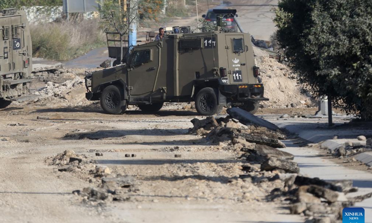 An Israeli military vehicle is seen during an Israeli raid in Jenin, northern West Bank, on Nov. 5, 2024. Four Palestinians were killed in Israeli airstrikes and gunfire in Jenin and Tubas, the Palestinian Health Ministry said Tuesday.  (Photo: Xinhua)