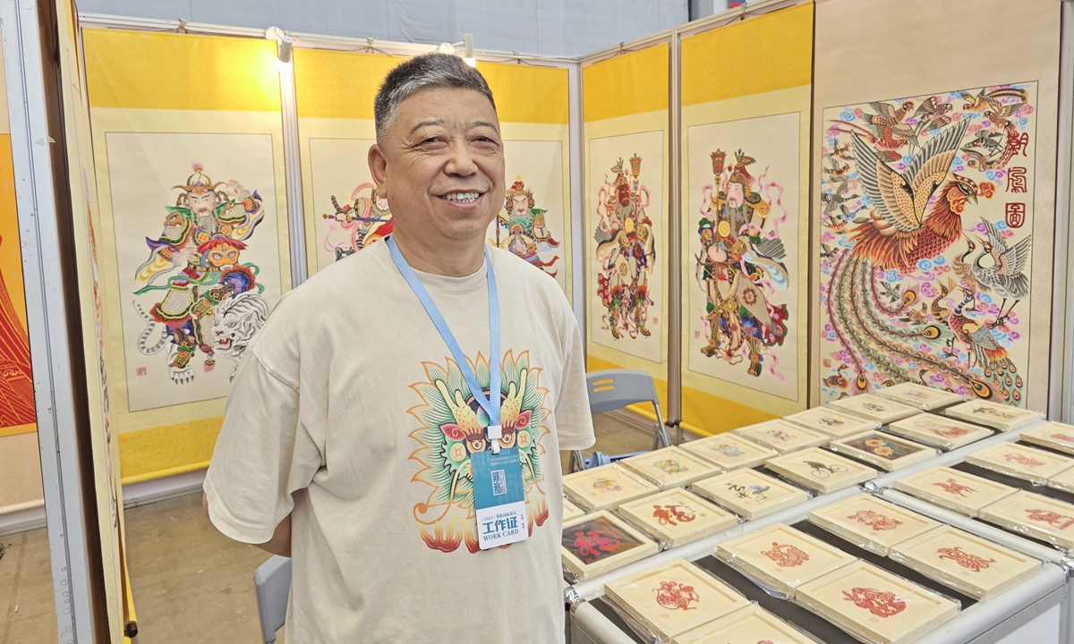 Gao Dianliang, a key inheritor of Yuxian's paper-cutting tradition, at the first Zheng He Cultural and Art Festival, alongside the Nanjing Maritime Silk Road Expo, opened at the Nanjing International Expo Center on July 11, 2024, which is also the Maritime Day of China Photo: Courtesy of Gao Dianliang