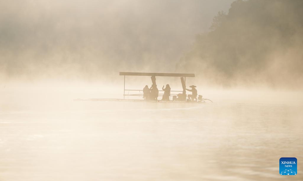 Tourists view bald cypress forests on a sightseeing raft at a wetland park in Fangtang Township of Ningguo City, east China's Anhui Province, Nov. 7, 2024.  (Photo: Xinhua)