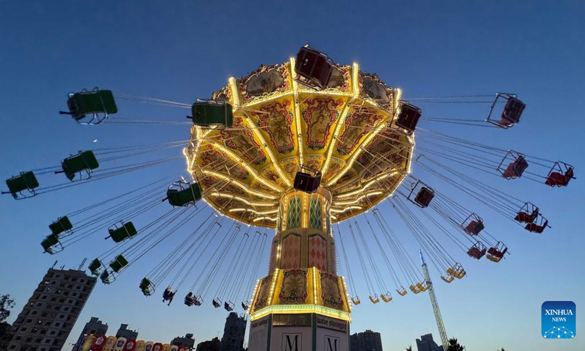 People enjoy their time at Winter Wonderland Kuwait in Hawalli Governorate, Kuwait, Nov. 7, 2024.

Winter Wonderland Kuwait, one of the largest entertainment projects in the country, opened its third season here on Thursday.(Photo: Xinhua)