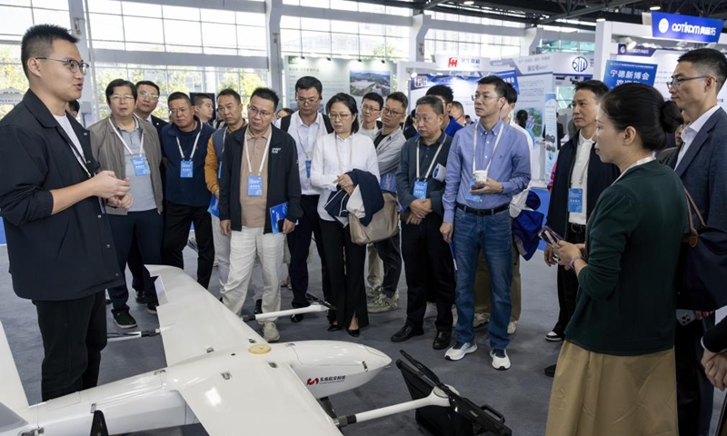 Participants learn about a drone during the World Energy Storage Conference 2024 in Ningde, southeast China's Fujian province, Nov. 7, 2024. Themed Charting a New Era of Global Energy Storage, Fostering a Pacesetter for Safe and Sustainable Development, the World Energy Storage Conference 2024 kicked off here on Thursday. (Photo: Xinhua)