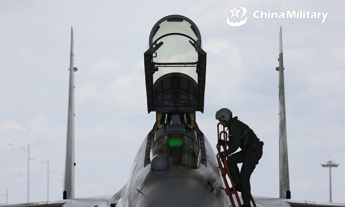 A pilot assigned to an aviation brigade with the air force under the Chinese PLA Southern Theater Command climbs into the cockpit of a J-16 fight jet prior to a multi-subject flight training exercise on August 28th, 2024.   (Photo: China Military Online)