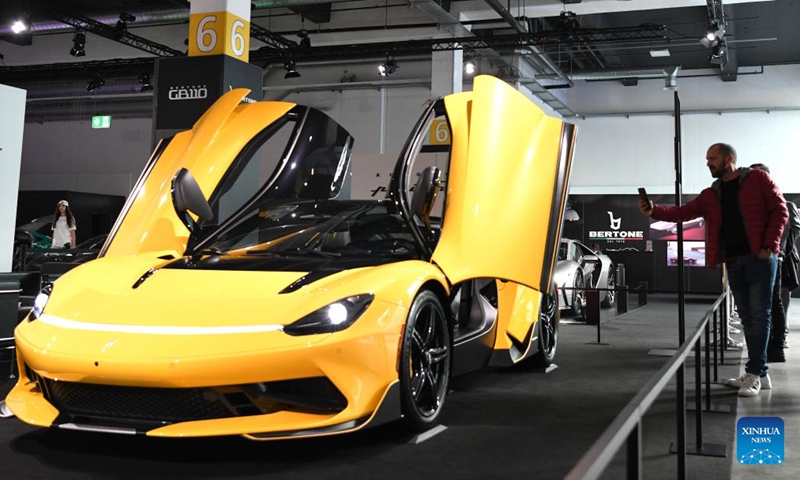 A visitor takes photos of a car at the Auto Zurich 2024 in Zurich, Switzerland, Nov. 8, 2024. (Photo: Xinhua)