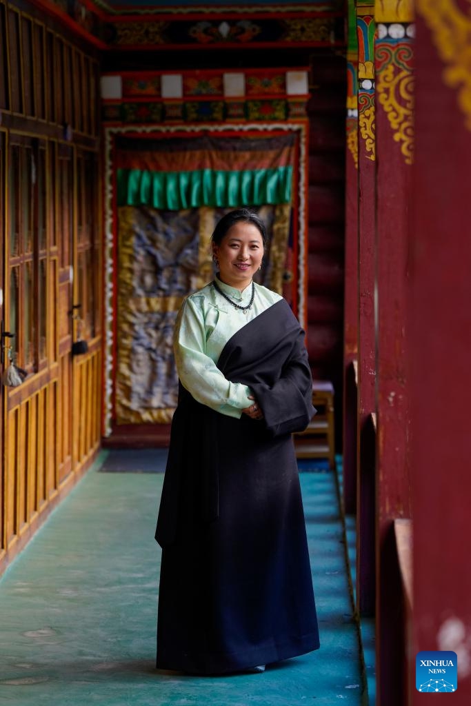 Dawa Drolma poses for a photo at her workshop in Maisu Town of Dege County in Garze Tibetan Autonomous Prefecture, southwest China's Sichuan Province, Nov. 3, 2024. (Photo: Xinhua)