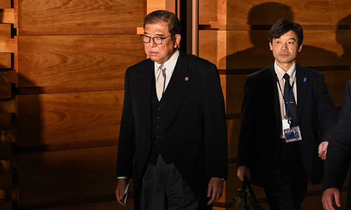 Japan's Prime Minister Shigeru Ishiba (left) leaves the prime minister's official residence to attend a ceremony with the emperor at the Imperial Palace in Tokyo on November 11, 2024. Photo: VCG