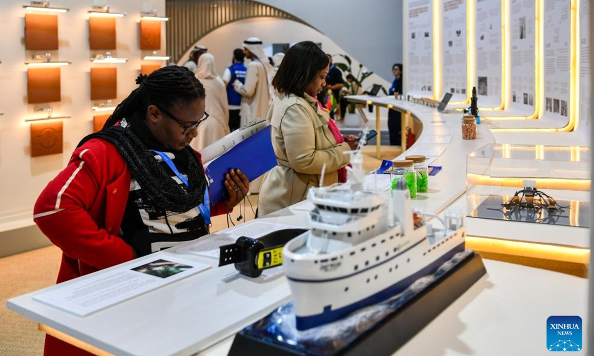 Attendees visit an exhibition area of the 29th session of the Conference of the Parties to the United Nations Framework Convention on Climate Change (UNFCCC) in Baku, Azerbaijan, Nov. 11, 2024.  (Photo: Xinhua)