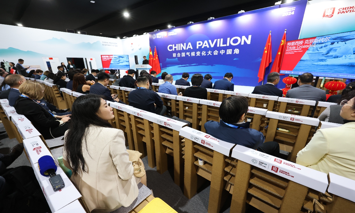 Attendees sit on chairs made from carboard at the China pavilion during the COP29 climate conference in Baku, Azerbaijan, on November 11, 2024. The United Nations climate change conference, COP29, runs through November 22. Photo: VCG