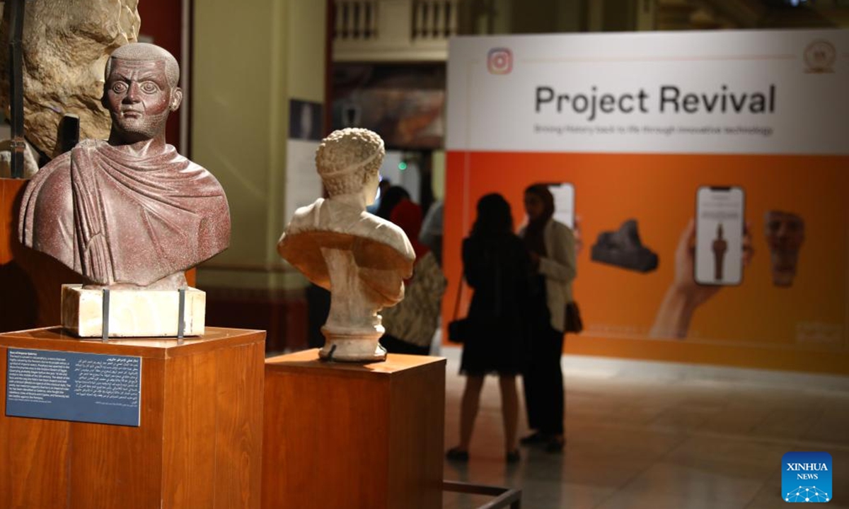 People are seen during the launch of a new digital filter application to reconstruct damaged ancient Egyptian artifacts at the Egyptian Museum in Cairo, Egypt, on Nov. 11, 2024. (Photo: Xinhua)