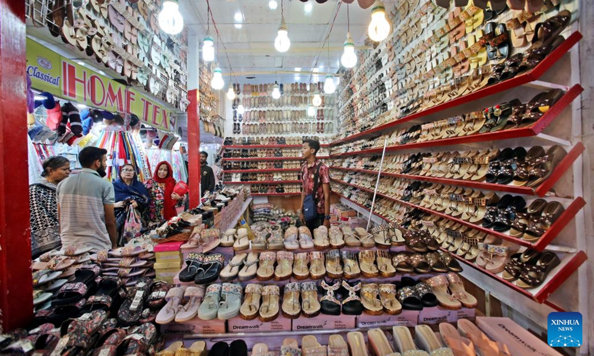 People select products at a trade fair in Dhaka, Bangladesh, on Nov. 11, 2024.  (Photo: Xinhua)