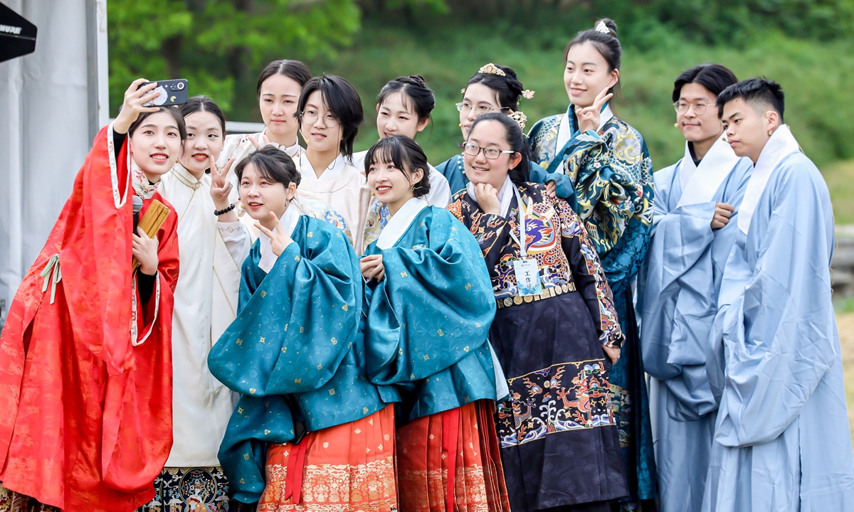 Hanfu enthusiasts take photos at the China Hanfu Day event in the Old Summer Palace, or Yuanmingyuan, in Beijing. Photo: Courtesy of the management office of Yuanmingyuan