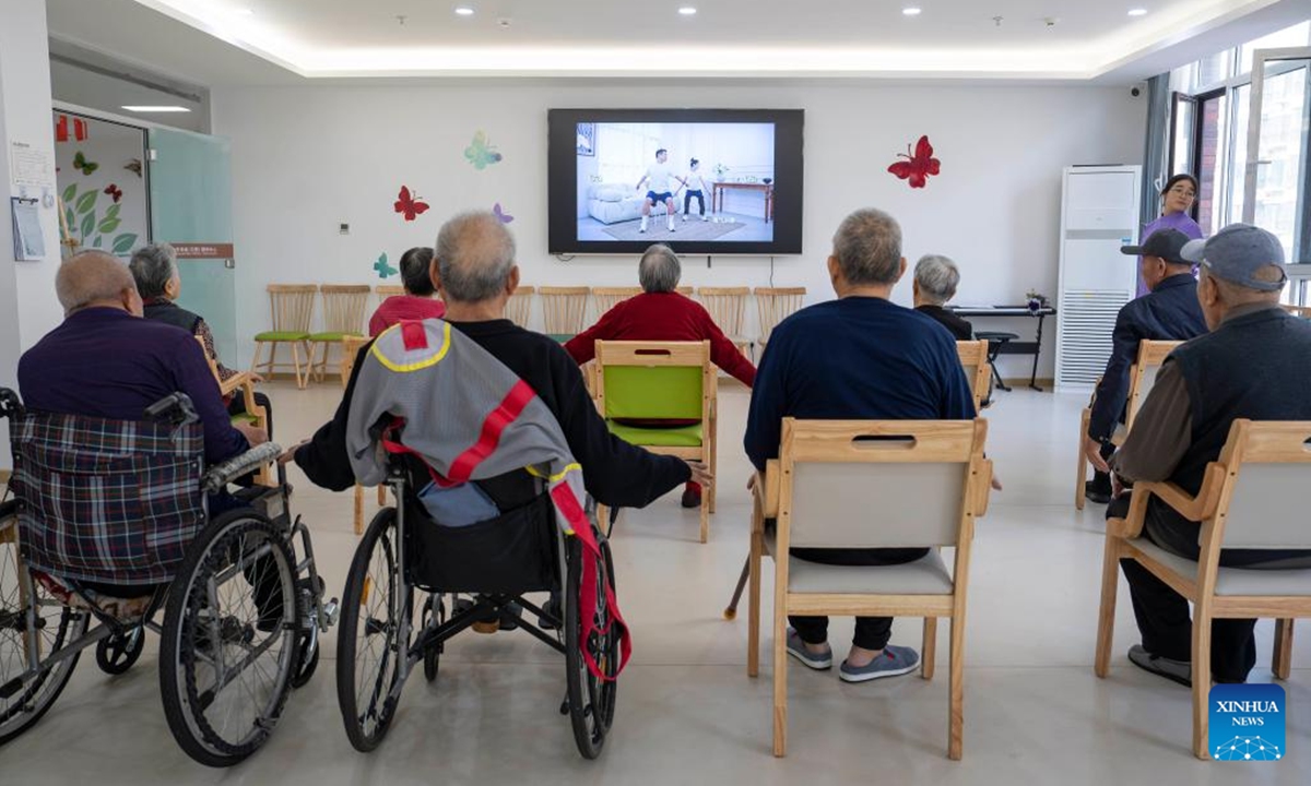 Senior residents do physical exercise at an elderly care center in Rizhao, east China's Shandong Province, Nov. 11, 2024.

The city of Rizhao has in recent years been committed to enhancing elderly care services that integrate medical, fitness, and daily care through at-home and community-based facilities.  (Photo: Xinhua)