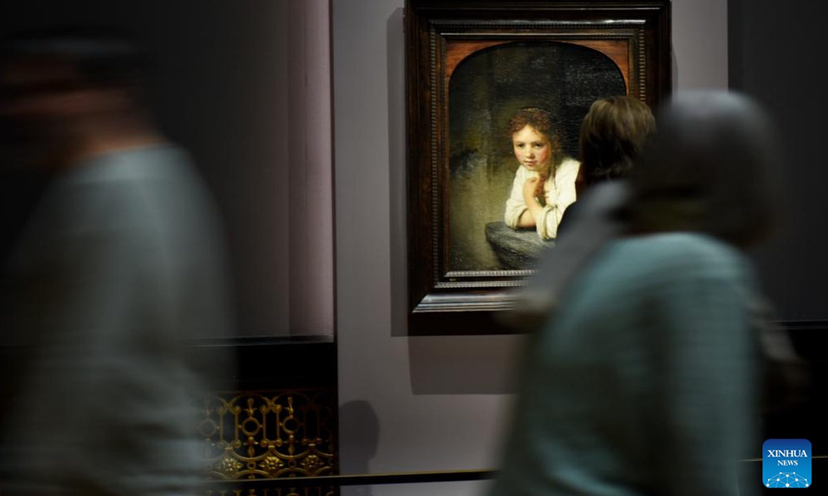 A visitor looks at a Rembrandt's painting work at Art History Museum Vienna, Austria, Nov. 13, 2024. A special exhibition named Rembrandt-Hoogstraten: Colour and Illusion is held here from Oct. 8, 2024 to Jan. 12, 2025.   (Photo: Xinhua)