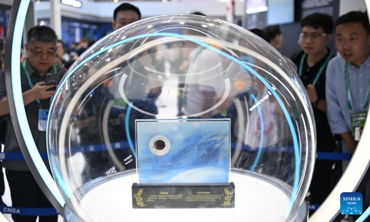 Visitors view Chang'e-6 mission lunar samples, collected from the far side of the moon, on display at the 15th China International Aviation and Aerospace Exhibition in Zhuhai, south China's Guangdong Province, Nov. 13, 2024. China's Chang'e-6 mission lunar samples, collected from the far side of the moon, are showcased at the 15th China International Aviation and Aerospace Exhibition. (Photo: Xinhua)