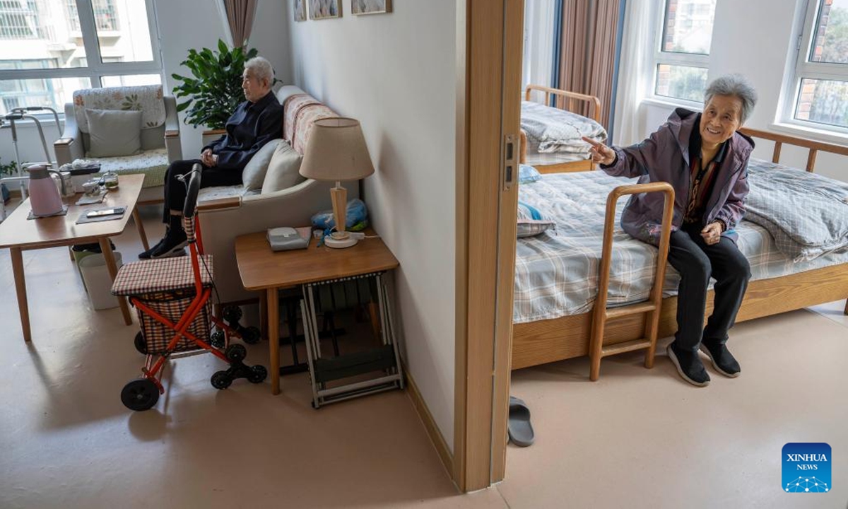 A senior couple takes a rest inside their suite at an elderly care center in Rizhao, east China's Shandong Province, Nov. 11, 2024.

The city of Rizhao has in recent years been committed to enhancing elderly care services that integrate medical, fitness, and daily care through at-home and community-based facilities.   (Photo: Xinhua)