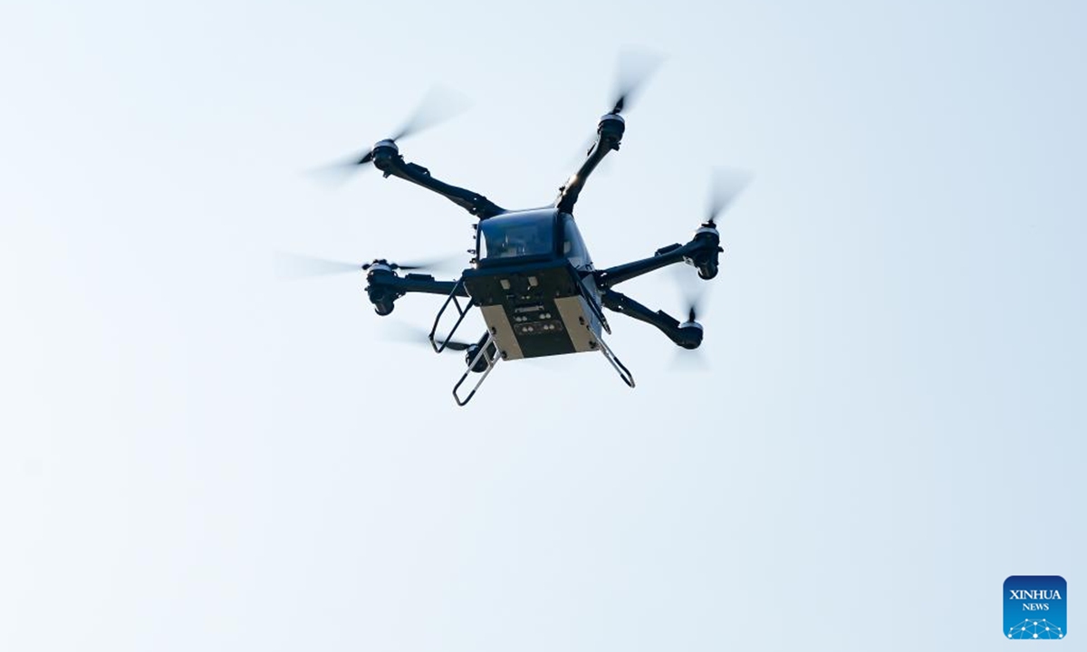 The Land Aircraft Carrier, a flying car developed by Chinese electric vehicle maker XPENG, is pictured in Zhuhai, south China's Guangdong Province, Nov. 12, 2024. The Land Aircraft Carrier completed its first public flight Tuesday at the 15th China International Aviation and Aerospace Exhibition, also known as Airshow China. (Xinhua)