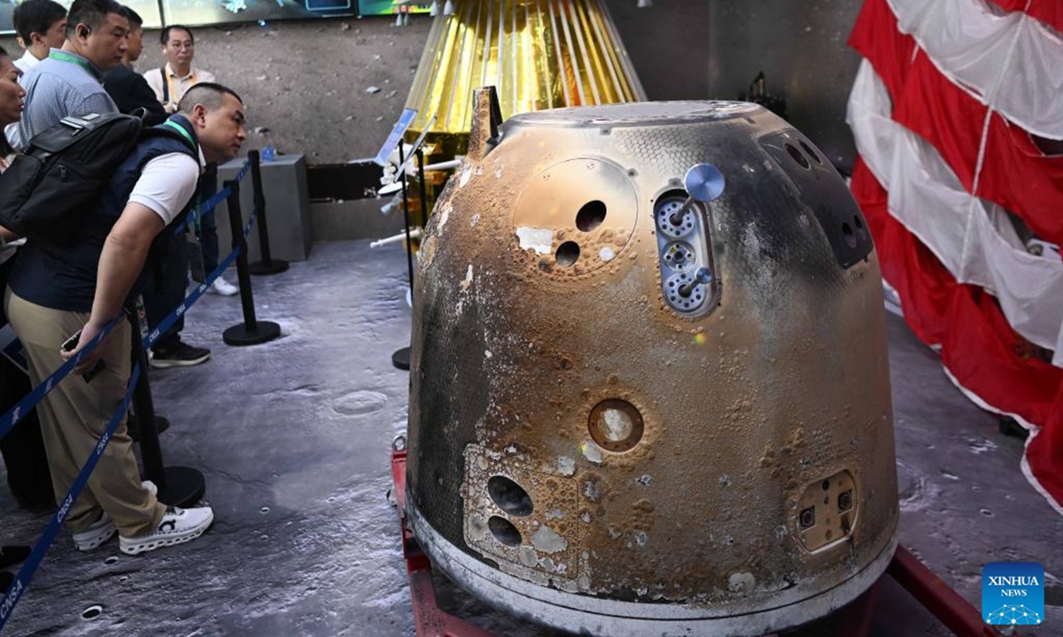 Visitors view the Chang'e-6 return capsule displayed at the 15th China International Aviation and Aerospace Exhibition in Zhuhai, south China's Guangdong Province, Nov. 13, 2024.

China's Chang'e-6 mission lunar samples, collected from the far side of the moon, are showcased at the 15th China International Aviation and Aerospace Exhibition. (Photo: Xinhua)