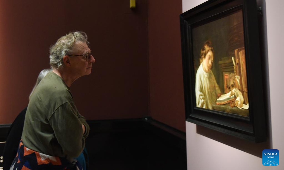 A visitor looks at a Hoogstraten's painting work at Art History Museum Vienna, Austria, Nov. 13, 2024. A special exhibition named Rembrandt-Hoogstraten: Colour and Illusion is held here from Oct. 8, 2024 to Jan. 12, 2025.  (Photo: Xinhua)