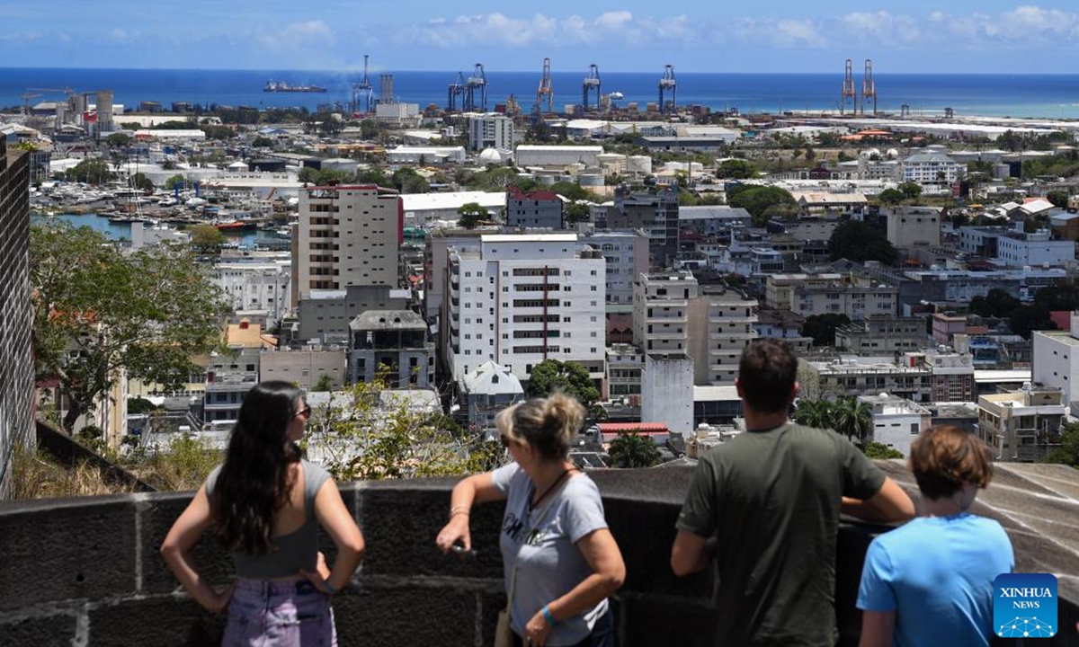 Tourists enjoy views of Port Louis in Mauritius on Nov. 9, 2024. Mauritius, an island nation situated in the southwestern Indian Ocean and off the eastern coast of Africa, is a melting pot of diverse cultures.  (Photo: Xinhua)