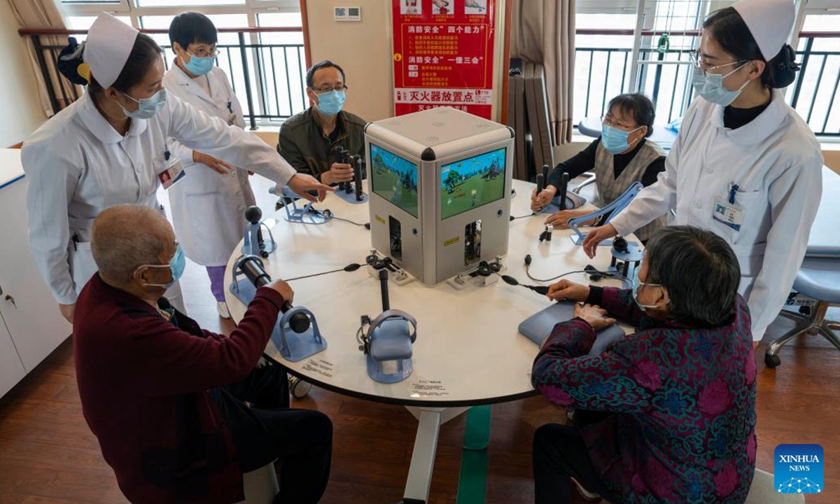 Senior residents undergo rehabilitation training at an elderly care center in Rizhao, east China's Shandong Province, Nov. 11, 2024.

The city of Rizhao has in recent years been committed to enhancing elderly care services that integrate medical, fitness, and daily care through at-home and community-based facilities.  (Photo: Xinhua)