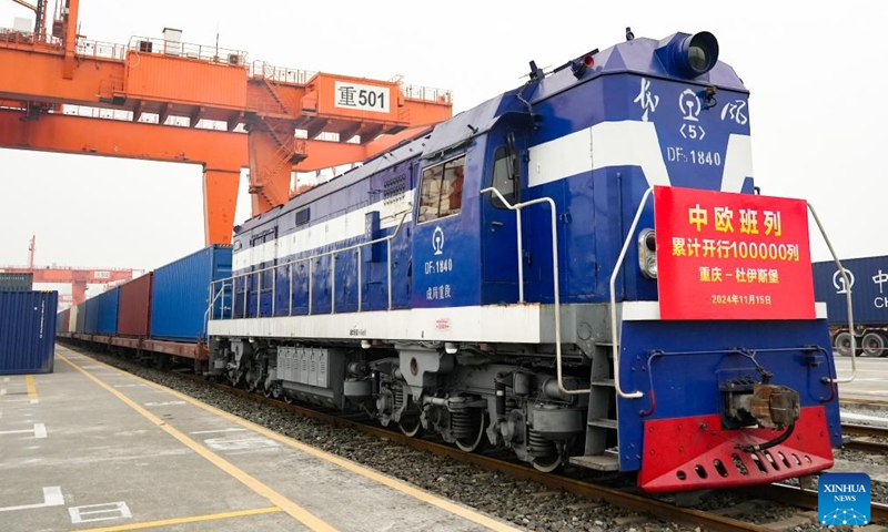 The 100,000th China-Europe freight train, coded X8083, waits for departing at the Tuanjiecun Station in Chongqing, southwest China, Nov. 15, 2024. The 100,000th China-Europe freight train departed from southwest China's Chongqing Municipality on Friday morning, a significant milestone in the development of the service that facilitates economic and trade exchanges between China and Europe. (Photo: Xinhua)