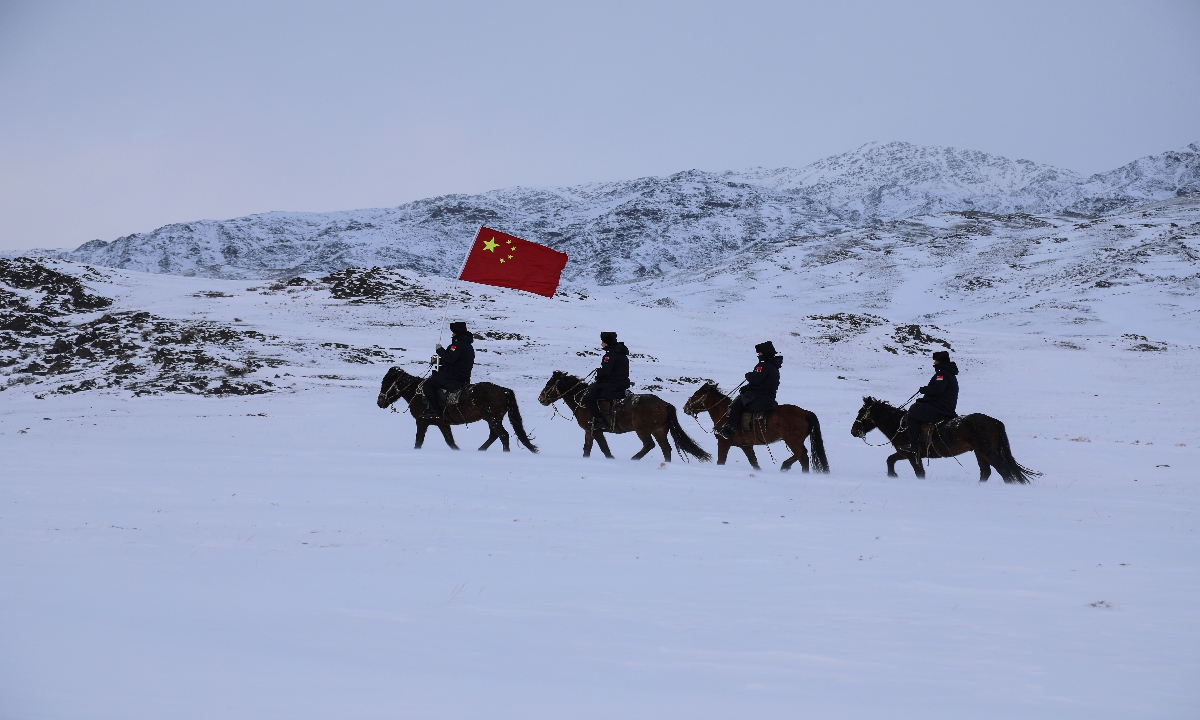 Patrol officers conduct an inspection on horseback in the border area in Altay, Northwest China's Xinjiang Uygur Autonomous Region, on November 14, 2024, as temperatures drop to -21 C in the region. The move is aimed at promptly and accurately monitoring the dynamics of the border area, ensuring safety and stability in the region. Photo: VCG