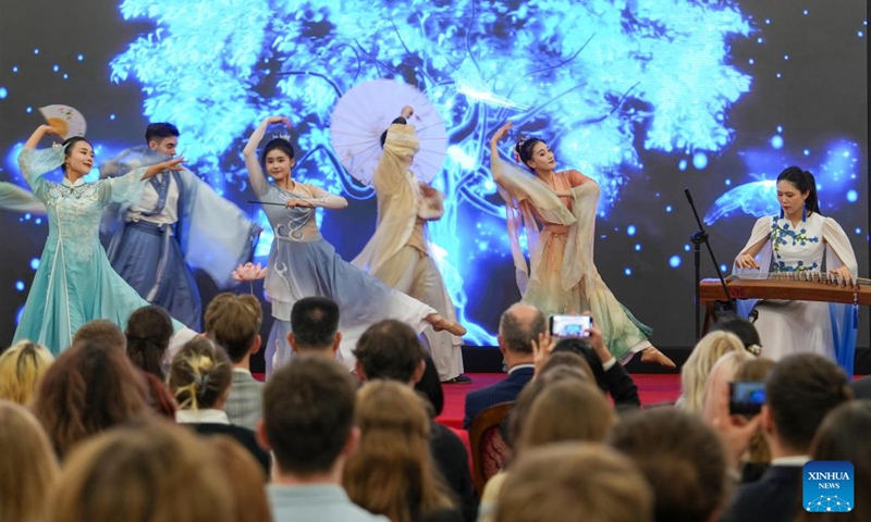 Members of the Dragon and Lion Art Troupe from China's Hubei University perform dances and guzheng (a traditional Chinese musical instrument) solo during an open day event as part of celebrations marking the 75th anniversary of diplomatic relations between China and Poland, at the Chinese Embassy in Poland in Warsaw, Poland, on Nov. 14, 2024. (Photo: Xinhua)