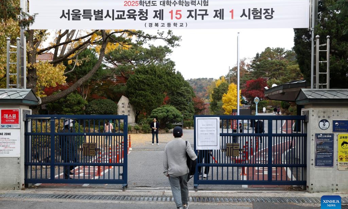 An examinee of the College Scholastic Ability Test (CSAT) enters the Gyeongbok High School in Seoul, South Korea, Nov. 14, 2024. South Korean students on Thursday took an annual college entrance exam, seen highly important in an education-obsessed society.
  (Photo: Xinhua)