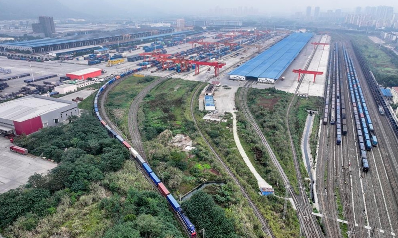 A drone photo taken on Nov. 15, 2024 shows the 100,000th China-Europe freight train, coded X8083, departing from the Tuanjiecun Station in Chongqing, southwest China. (Photo: Xinhua)