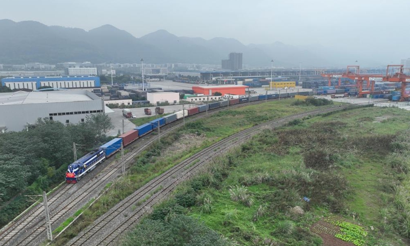 A drone photo taken on Nov. 15, 2024 shows the 100,000th China-Europe freight train, coded X8083, departing from the Tuanjiecun Station in Chongqing, southwest China. (Photo: Xinhua)