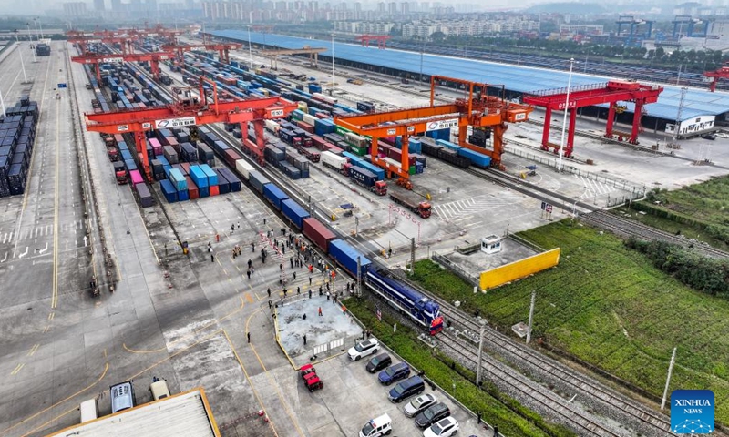 A drone photo taken on Nov. 15, 2024 shows the 100,000th China-Europe freight train, coded X8083, departing from the Tuanjiecun Station in Chongqing, southwest China. (Photo: Xinhua)