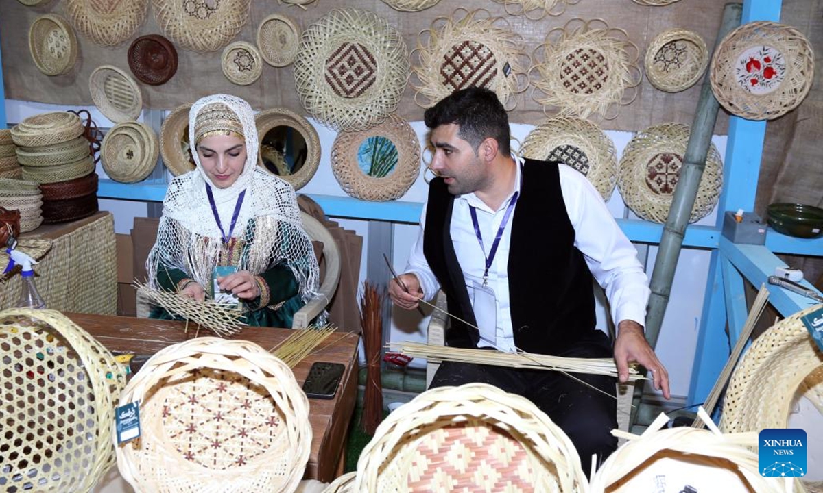 Exhibitors showcase handicraft-making skills during the 37th National Handicrafts Exhibition in Tehran, Iran, Nov. 13, 2024. The exhibition opened here Wednesday. (Xinhua)