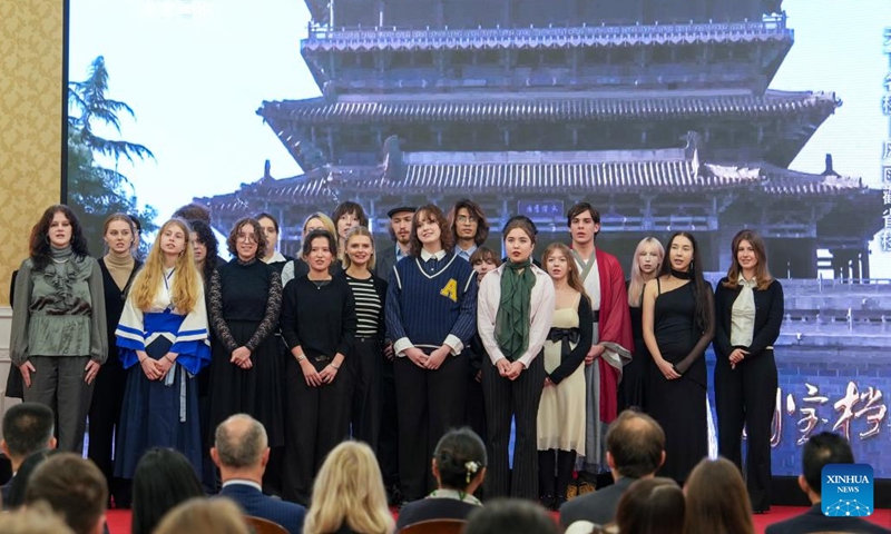 Polish college students perform a choral rendition of a Chinese song during an open day event as part of celebrations marking the 75th anniversary of diplomatic relations between China and Poland, at the Chinese Embassy in Poland in Warsaw, Poland, on Nov. 14, 2024. (Photo: Xinhua)