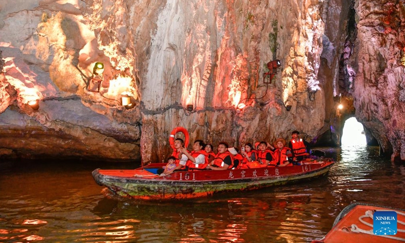 Tourists take a sightseeing boat at Huangguoshu Scenic Area in Anshun City, southwest China's Guizhou Province, Nov. 14, 2024. (Photo: Xinhua)