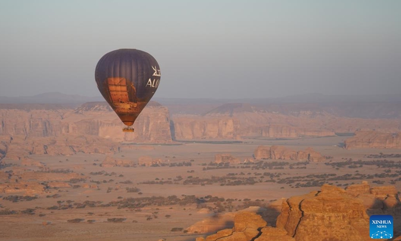 Tourists take a ride in a hot air balloon in AlUla, Saudi Arabia, Nov. 16, 2024. Themed Hegra Sunrise Sky Tour, a hot air balloon event took place on Saturday at Hegra, a UNESCO World Heritage Site in AlUla. (Xinhua/Luo Chen)