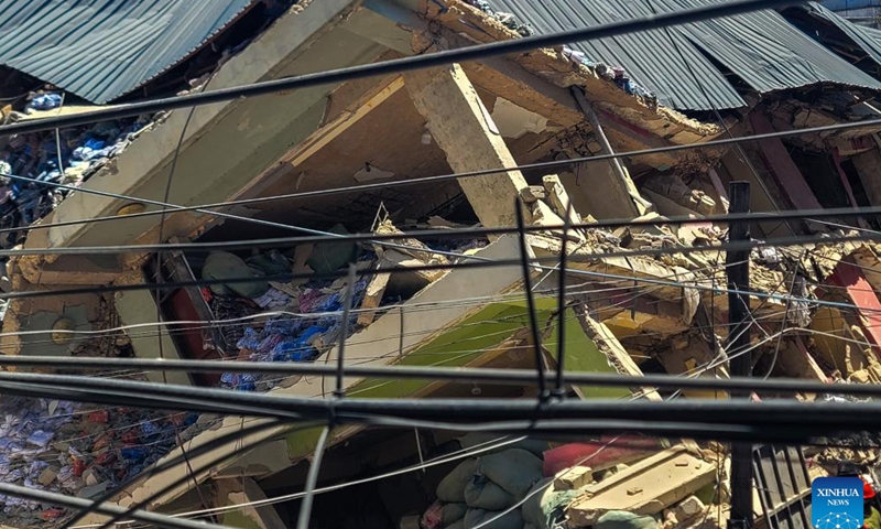 This photo shows a collapsed building in the Kariakoo suburb of Dar es Salaam, Tanzania, on Nov. 16, 2024. Tanzanian Prime Minister Kassim Majaliwa announced on Saturday that one person was killed and 28 others were injured when a four-story building collapsed in the Kariakoo suburb of Dar es Salaam, the country's port city. (Str/Xinhua)