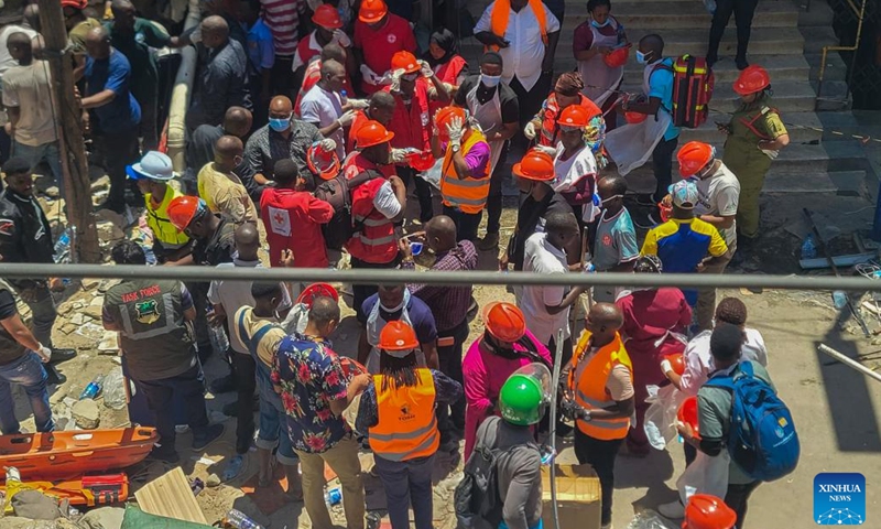 This photo taken on Nov. 16, 2024 shows survivors of a collapsed building in the Kariakoo suburb of Dar es Salaam, Tanzania. Tanzanian Prime Minister Kassim Majaliwa announced on Saturday that one person was killed and 28 others were injured when a four-story building collapsed in the Kariakoo suburb of Dar es Salaam, the country's port city. (Str/Xinhua)