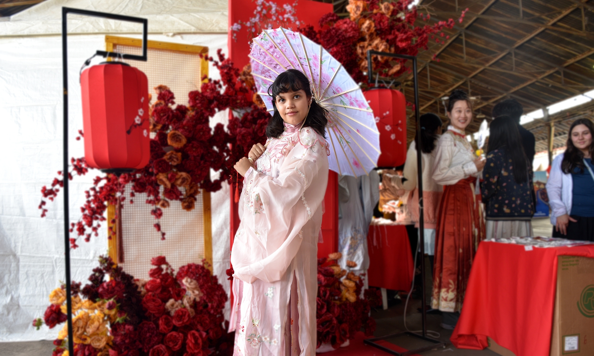 A Brazilian girl wearing Chinese Hanfu poses for a photo during the Festival of Chinese Immigration in Campinas city, Brazil on August 11, 2024. Photo: IC