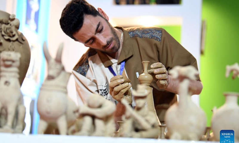 An exhibitor showcases handicraft-making skills during the 37th National Handicrafts Exhibition in Tehran, Iran, Nov. 16, 2024. The four-day exhibition closed here Saturday. (Xinhua/Shadati)