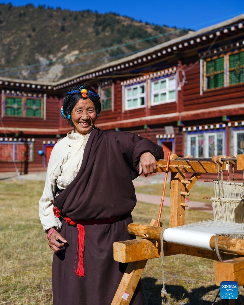 Doltru is pictured at her workshop in Dege County of Garze Tibetan Autonomous Prefecture, southwest China's Sichuan Province, Nov. 3, 2024.(Xinhua/Shen Bohan)