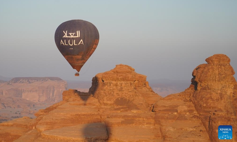 Tourists take a ride in a hot air balloon in AlUla, Saudi Arabia, Nov. 16, 2024. Themed Hegra Sunrise Sky Tour, a hot air balloon event took place on Saturday at Hegra, a UNESCO World Heritage Site in AlUla. (Xinhua/Luo Chen)