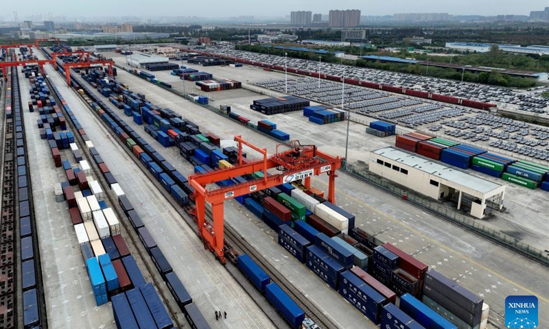 An aerial drone photo shows a view at a railway station of CRIntermodal in Wuhan, central China's Hubei Province, Nov. 16, 2024. The China-Europe freight train (Wuhan) service has 55 international logistics channels reaching 40 countries and regions and 117 cities. It has become an important transportation channel of import and export for domestic foreign trade enterprises. (Xinhua/Xing Guangli)