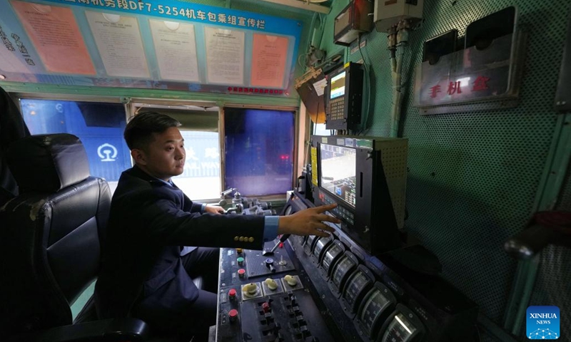 A train driver makes preparation at a railway station of CRIntermodal in Wuhan, central China's Hubei Province, Nov. 16, 2024. The China-Europe freight train (Wuhan) service has 55 international logistics channels reaching 40 countries and regions and 117 cities. It has become an important transportation channel of import and export for domestic foreign trade enterprises. (Xinhua/Xing Guangli)