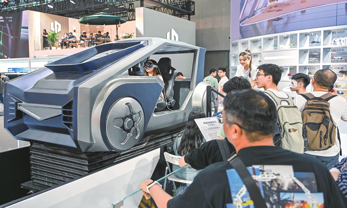 Visitors experience a simulator at the CATL booth at the 22nd Guangzhou International Automobile Exhibition on November 17, 2024 in Guangzhou, South China's Guangdong Province. The exhibition is showcasing 1,171 vehicles, including 78 that made their global debuts. 
Photo: VCG