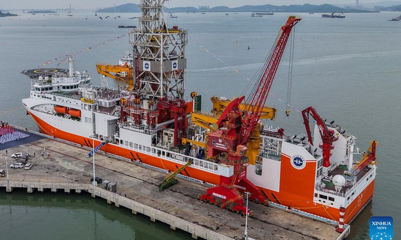 An aerial drone photo shows the Meng Xiang, China's first domestically designed and built deep-ocean drilling vessel, in Guangzhou, south China's Guangdong Province, Nov. 17, 2024. The Meng Xiang, China's first domestically designed and built deep-ocean drilling vessel with a maximum drilling depth of 11 kilometers was officially commissioned in the southern Chinese metropolis of Guangzhou on Sunday, marking a significant stride to reach where humanity has never ventured before. (Xinhua/Liu Dawei)