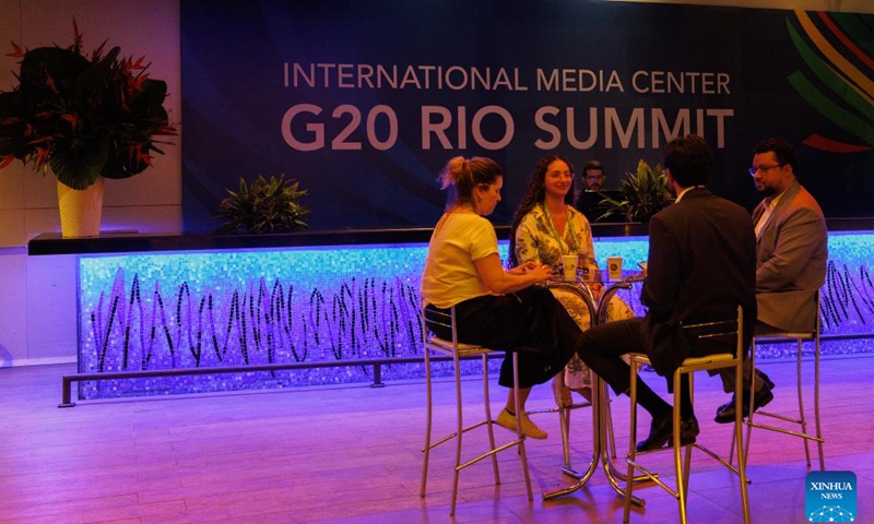 Journalists talk at the G20 International Media Center in Rio de Janeiro, Brazil, on Nov. 17, 2024. The International Media Center for the 19th G20 Summit was officially inaugurated on Sunday. (Photo by Claudia Martini/Xinhua)