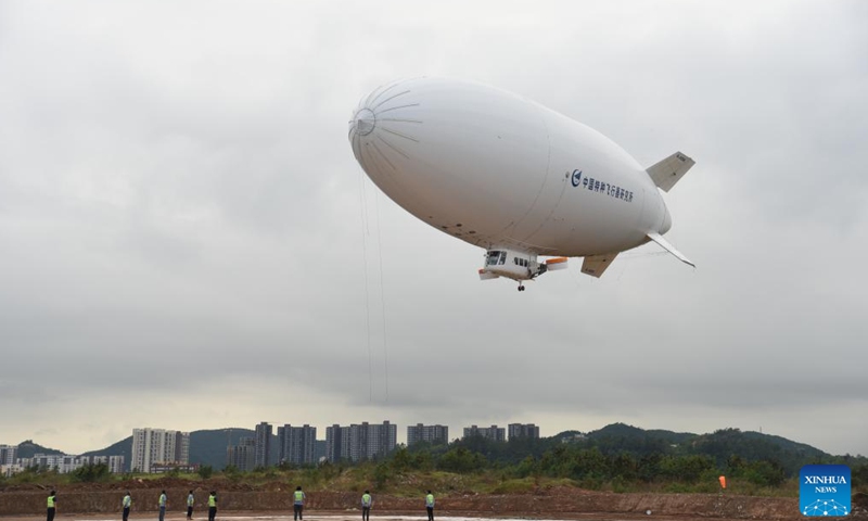 A civil manned AS700 airship prepares to land during the 15th China International Aviation and Aerospace Exhibition, also known as Airshow China, in Zhuhai, south China's Guangdong Province, Nov. 15, 2024. (Xinhua/Hong Zehua)