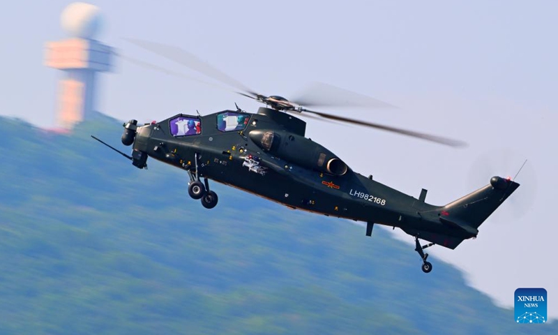 A helicopter of the Chinese People's Liberation Army (PLA) takes part in a performance during Airshow China in Zhuhai, south China's Guangdong Province, Nov. 12, 2024. The 15th China International Aviation and Aerospace Exhibition, also known as Airshow China, was held in Zhuhai from Nov. 12 to 17. (Photo by Xu Yang/Xinhua)